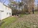 Expansive backyard with a brick patio, seating area, and lush lawn at 5421 Woodcreek Dr, Charlotte, NC 28226