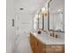 Bathroom with double vanity, large mirrors, and glass shower at 5421 Woodcreek Dr, Charlotte, NC 28226