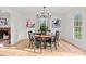 Formal dining area features a round table, fireplace, chandelier, and natural light at 5421 Woodcreek Dr, Charlotte, NC 28226