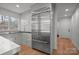 Stainless steel refrigerator and cabinets are featured in this spacious and modern kitchen at 5421 Woodcreek Dr, Charlotte, NC 28226
