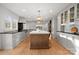 Open concept kitchen with a center island, stainless appliances, and plenty of storage at 5421 Woodcreek Dr, Charlotte, NC 28226