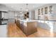 Spacious kitchen with a large island, stainless steel appliances, and custom cabinets at 5421 Woodcreek Dr, Charlotte, NC 28226