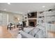 Comfortable living room with fireplace, built-in bookshelves, and neutral colors at 5421 Woodcreek Dr, Charlotte, NC 28226