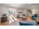 Sun-filled living room with hardwood floors leading to other rooms at 5421 Woodcreek Dr, Charlotte, NC 28226