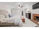 Bright main bedroom featuring a fireplace, ceiling fan, and closet at 5421 Woodcreek Dr, Charlotte, NC 28226