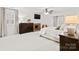 Cozy bedroom with fireplace, large window, hardwood furniture and soft carpeting at 5421 Woodcreek Dr, Charlotte, NC 28226