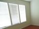 Bedroom with three large windows at 5963 Pale Moss Ln, Charlotte, NC 28269