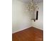 Traditional dining room with hardwood floors and an elegant crystal chandelier at 5963 Pale Moss Ln, Charlotte, NC 28269