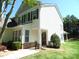 Inviting two-story home featuring a well-manicured lawn, charming shutters, and a welcoming front entrance at 5963 Pale Moss Ln, Charlotte, NC 28269