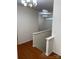 Second floor hallway featuring a light fixture and hardwood flooring at 5963 Pale Moss Ln, Charlotte, NC 28269