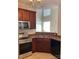 Bright kitchen featuring modern appliances, a corner sink, and generous counter space at 5963 Pale Moss Ln, Charlotte, NC 28269