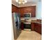 Well-equipped kitchen featuring stainless steel appliances and warm wood cabinetry at 5963 Pale Moss Ln, Charlotte, NC 28269
