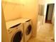 Laundry room featuring a side-by-side washer and dryer in a separate laundry room at 5963 Pale Moss Ln, Charlotte, NC 28269