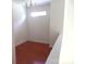 Cozy loft space with wood flooring and a window, perfect for a reading nook at 5963 Pale Moss Ln, Charlotte, NC 28269