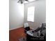 Office with hardwood floors, a window, and ceiling fan, providing a functional workspace at 5963 Pale Moss Ln, Charlotte, NC 28269