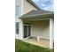 Covered patio with sliding door to backyard and concrete flooring at 5963 Pale Moss Ln, Charlotte, NC 28269