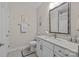 Bathroom featuring a single sink vanity, a large mirror, and modern fixtures at 6015 Pleasant Run Dr, Matthews, NC 28104