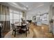Open concept dining area adjacent to kitchen with large windows for natural light and views at 6015 Pleasant Run Dr, Matthews, NC 28104