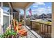 Inviting covered front porch with rocking chairs and an American flag view for a touch of Americana at 6015 Pleasant Run Dr, Matthews, NC 28104