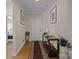 Welcoming hallway features hardwood floors, a console table, and artwork creating a stylish entrance at 6015 Pleasant Run Dr, Matthews, NC 28104
