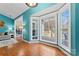 Cozy living area with large bay windows offering plenty of natural light and hardwood flooring at 613 Trailing Rock Dr, Charlotte, NC 28214