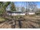 A well-maintained backyard with lush grass and a charming single-story home at 629 Johns Ln, Gastonia, NC 28052
