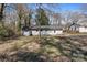 Backyard view with a detached shed and a well-maintained lawn at 629 Johns Ln, Gastonia, NC 28052
