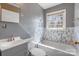 Bathroom features a tub and shower combination and tiled wall at 629 Johns Ln, Gastonia, NC 28052