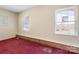 Cozy bedroom with neutral walls and two windows providing natural light at 629 Johns Ln, Gastonia, NC 28052