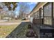 View of the front porch with brick accents and a black iron railing at 629 Johns Ln, Gastonia, NC 28052
