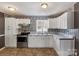 Bright kitchen features modern appliances, ample counter space and tile backsplash at 629 Johns Ln, Gastonia, NC 28052