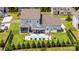 Expansive backyard with a pool, outdoor seating areas, and manicured landscaping at 7133 Sumters Camp Trl, Fort Mill, SC 29707