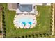 Overhead view of a backyard featuring a sparkling pool, and mature trees at 7133 Sumters Camp Trl, Fort Mill, SC 29707