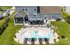 Aerial view of the backyard oasis featuring a swimming pool, lounge chairs, and a gazebo at 7133 Sumters Camp Trl, Fort Mill, SC 29707