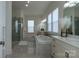 Elegant bathroom boasts a luxurious soaking tub, double vanity, and a glass-enclosed shower at 7133 Sumters Camp Trl, Fort Mill, SC 29707