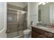 Well-maintained bathroom with modern glass shower, tiled walls and granite vanity provides a clean aesthetic at 7133 Sumters Camp Trl, Fort Mill, SC 29707