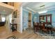 Formal dining room with elegant chandelier, coffered ceilings, and modern decor at 7133 Sumters Camp Trl, Fort Mill, SC 29707
