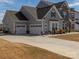 Beautiful home featuring an attached two car garage and meticulously landscaped front yard at 7133 Sumters Camp Trl, Fort Mill, SC 29707