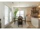 Cozy breakfast nook off kitchen featuring backyard views, with stylish decorative chandelier and access to balcony at 7133 Sumters Camp Trl, Fort Mill, SC 29707
