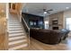 Welcoming living room with adjacent stairway, fireplace and contemporary decorative wall creating a stylish space at 7133 Sumters Camp Trl, Fort Mill, SC 29707