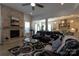 Open-concept living room with a fireplace, modern decor, and seamless flow into the kitchen at 7133 Sumters Camp Trl, Fort Mill, SC 29707