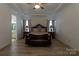 Spacious main bedroom featuring a tray ceiling, bench, and ensuite at 7133 Sumters Camp Trl, Fort Mill, SC 29707