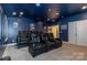 Home media room featuring tiered seating, a projector, and plush, luxurious reclining chairs at 7133 Sumters Camp Trl, Fort Mill, SC 29707