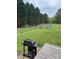 Large fenced-in yard with a grill, wood deck, and space for outdoor enjoyment at 730 Jackson Rd, Salisbury, NC 28146