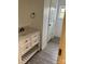 Bathroom featuring a white vanity, wood-look flooring, and a window at 730 Jackson Rd, Salisbury, NC 28146