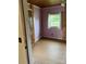 Cozy bedroom with wood floors, trim, window, closet and a painted purple accent wall at 730 Jackson Rd, Salisbury, NC 28146