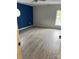 Spacious bedroom features wood-look floors, a window, and a blue accent wall at 730 Jackson Rd, Salisbury, NC 28146