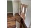 Entryway featuring wood-look floors, a wooden front door with glass, and a white door at 730 Jackson Rd, Salisbury, NC 28146