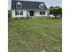Charming home featuring dormers, a covered porch, and a well-manicured front lawn at 730 Jackson Rd, Salisbury, NC 28146