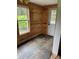 Mud room features slate tile flooring, wood paneled walls and a window for great natural light at 730 Jackson Rd, Salisbury, NC 28146